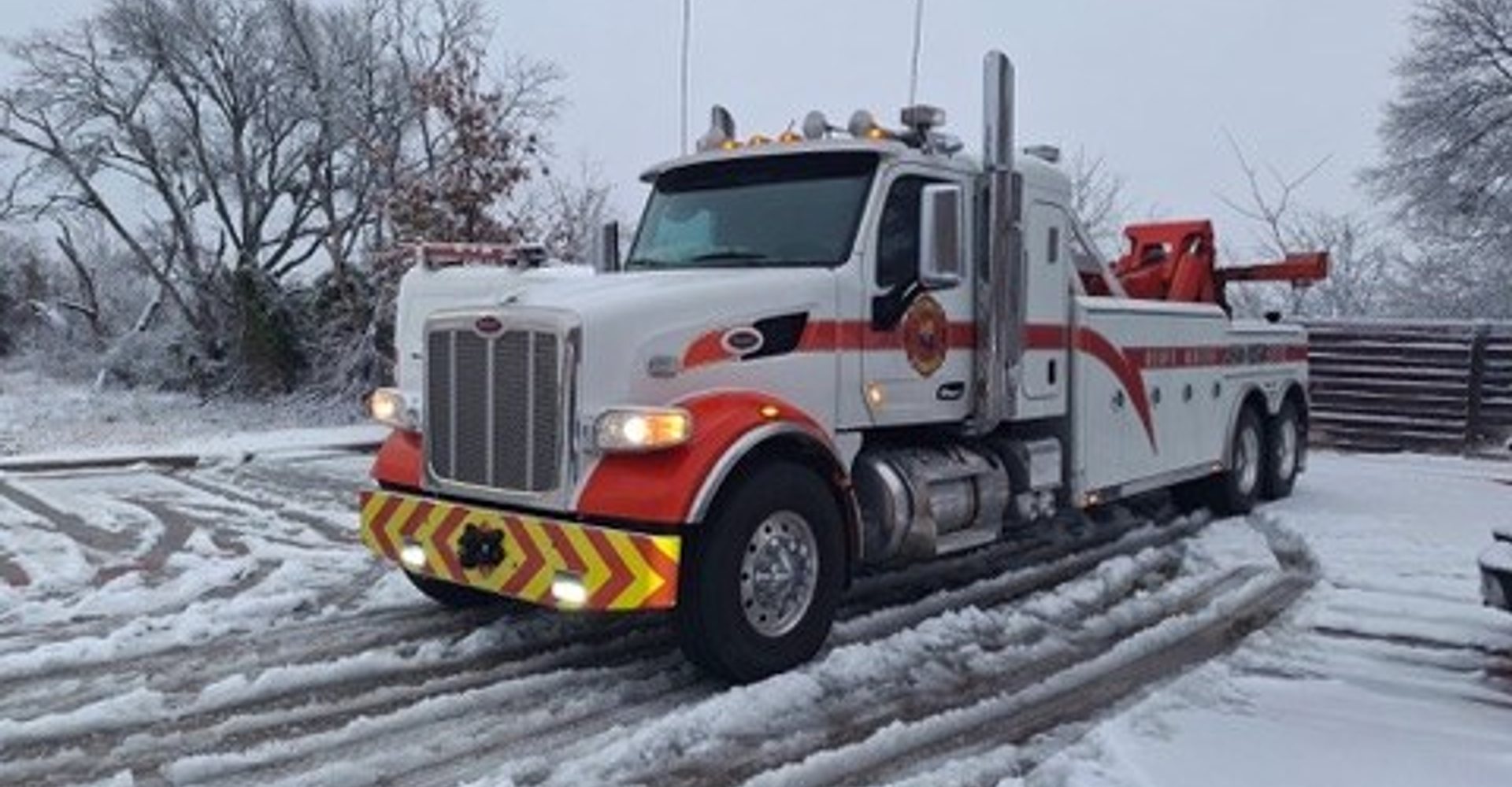 Heavy tow truck operating in Arizona high-country snow