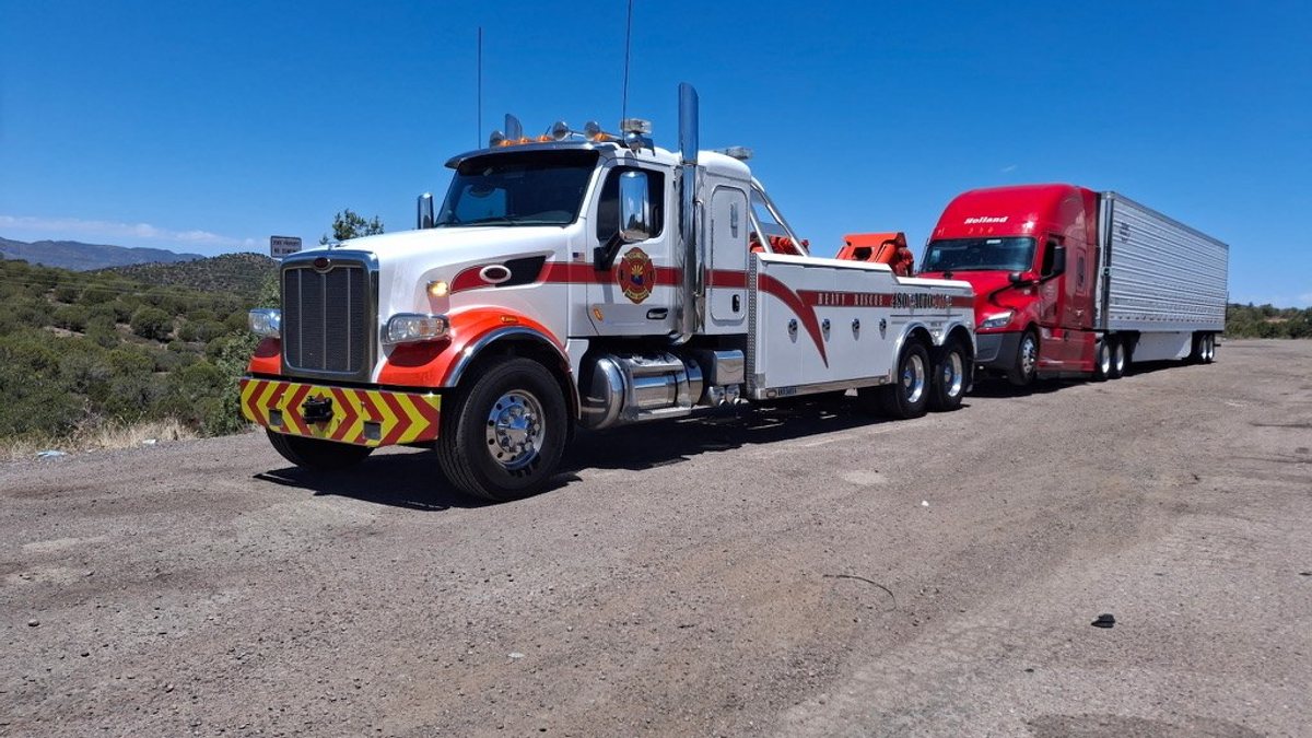 Heavy Rescue wrecker towing a loaded semi truck on an Arizona highway